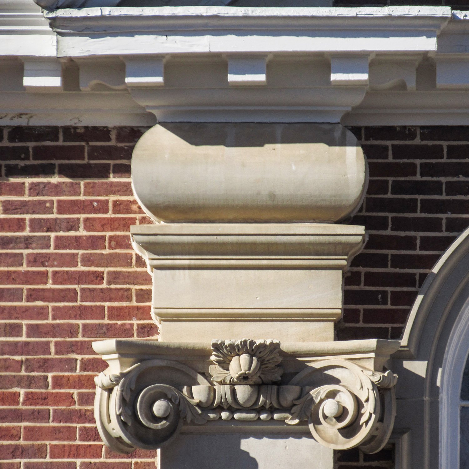 Dentilled cornice, cushion capital, and Scamozzi capital on the facade of North Fulton High School, Atlanta