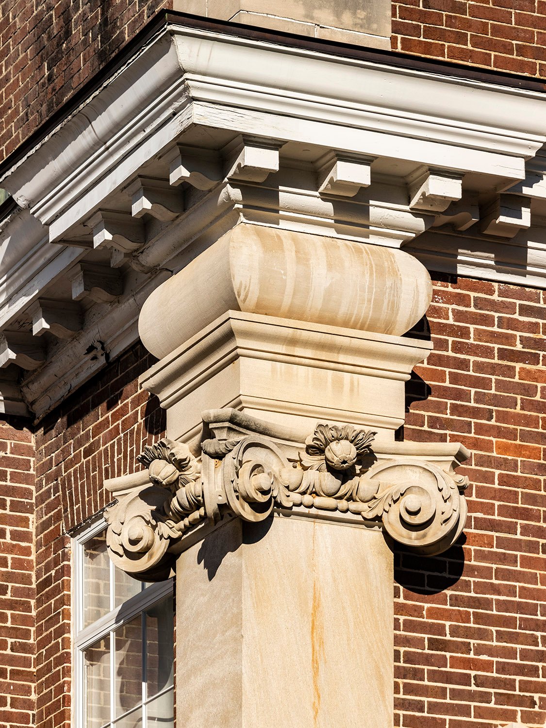 Dentilled cornice, cushion capital, Scamozzi capital, and pilaster on the facade of North Fulton High School, Atlanta