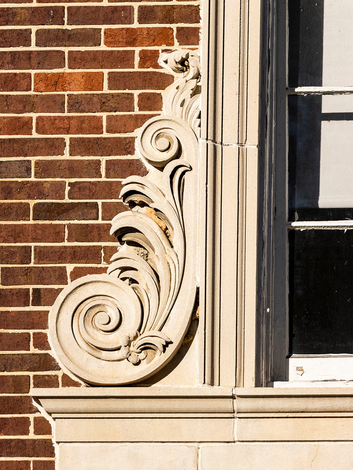 Cast-stone volute and cornice above the main entrance of North Fulton High School, Atlanta