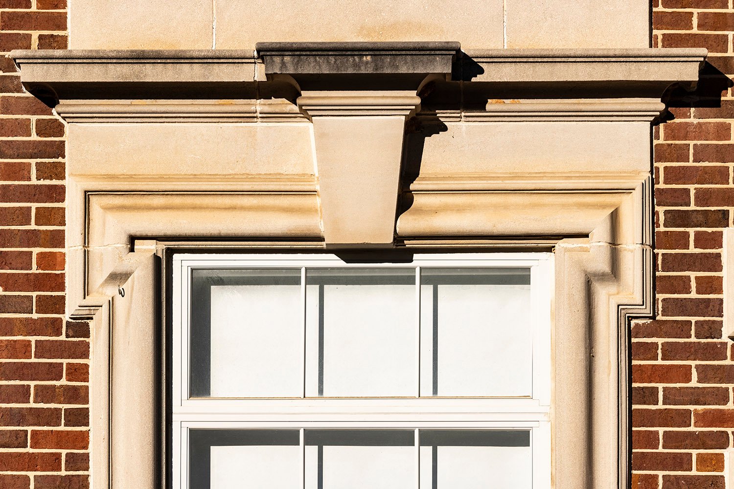 Keystone and pediment over a first-floor window on the facade of North Fulton High School, Atlanta
