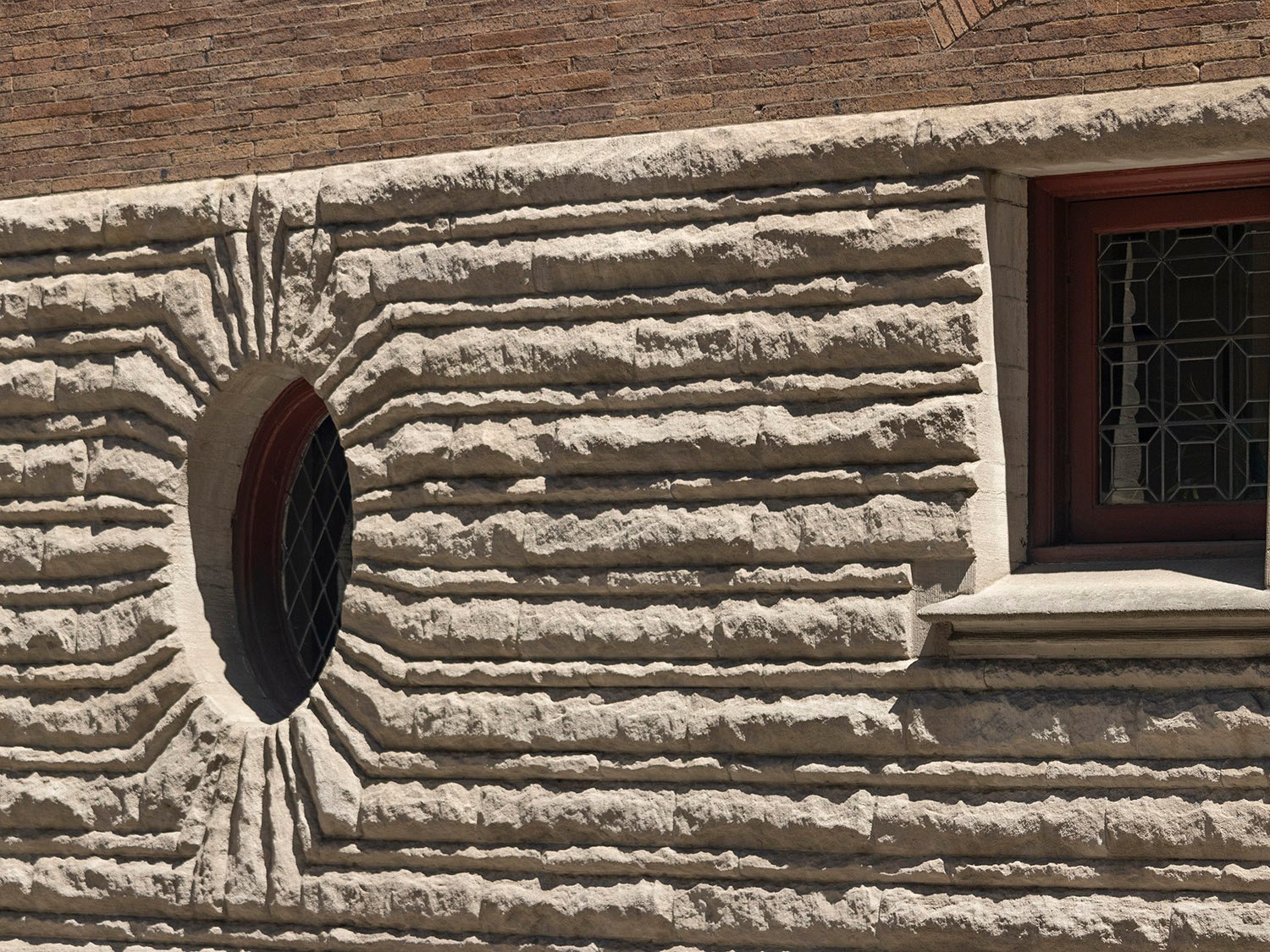 First-floor windows and rusticated limestone on the west elevation of the Clarence B. Moore Residence, Philadelphia
