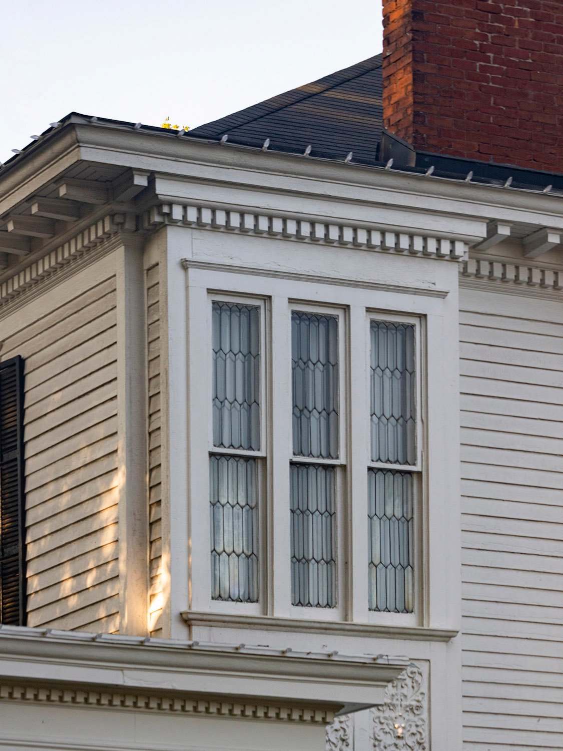 Second-floor bay window and dentilled cornice on the facade of the H.C. Dobbs Residence, Marietta, Georgia