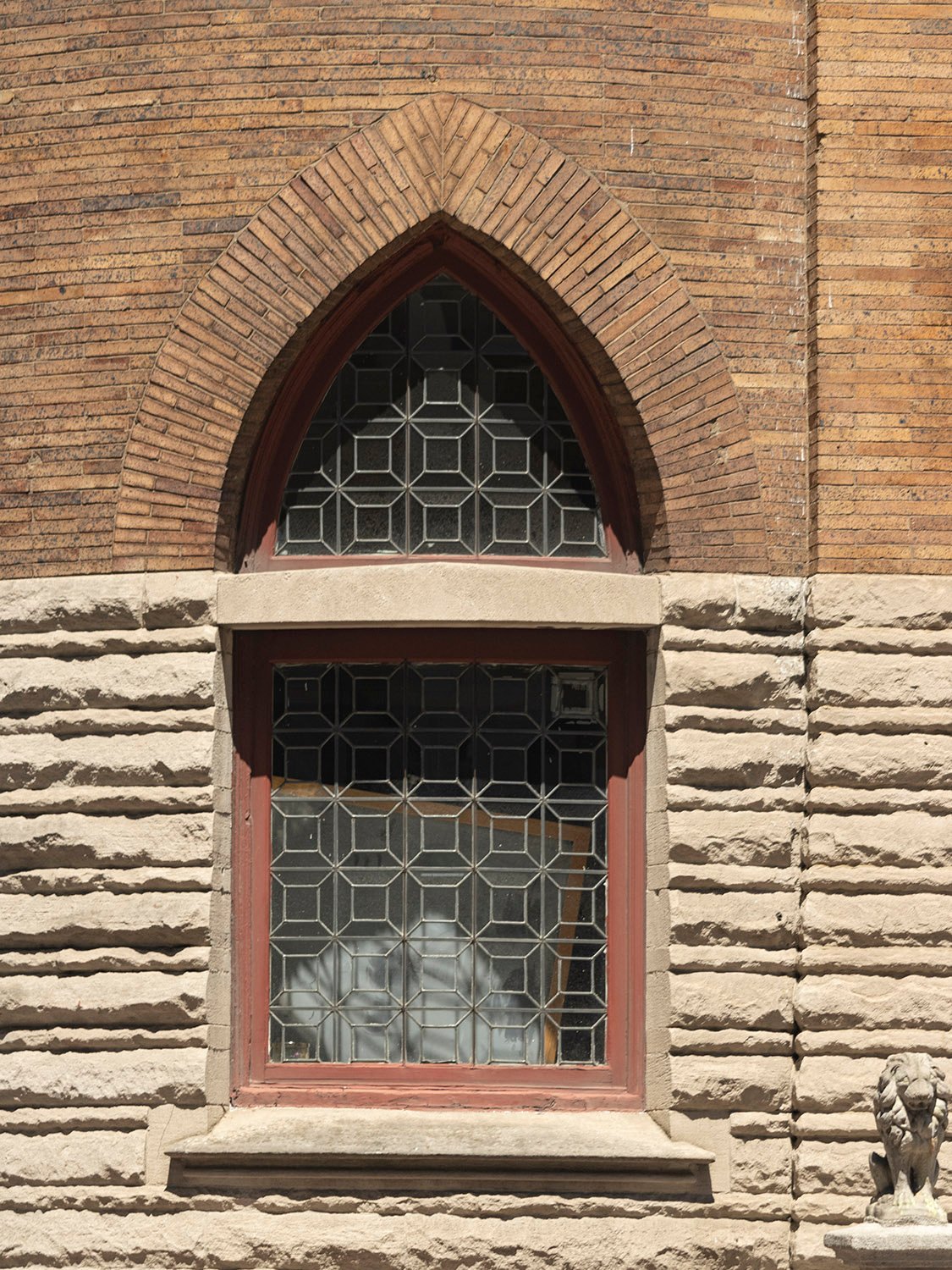 First-floor window on the front circular tower of the Clarence B. Moore Residence, Philadelphia
