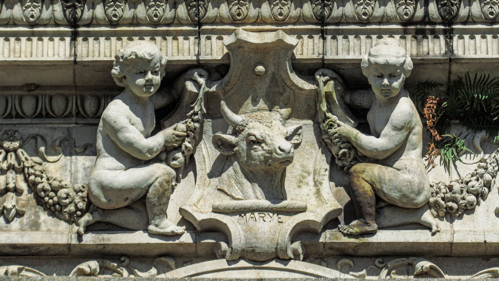 Cherubs and P. Thornton Marye's signature on the facade of the Gulf, Mobile and Ohio Passenger Terminal, Mobile, Alabama