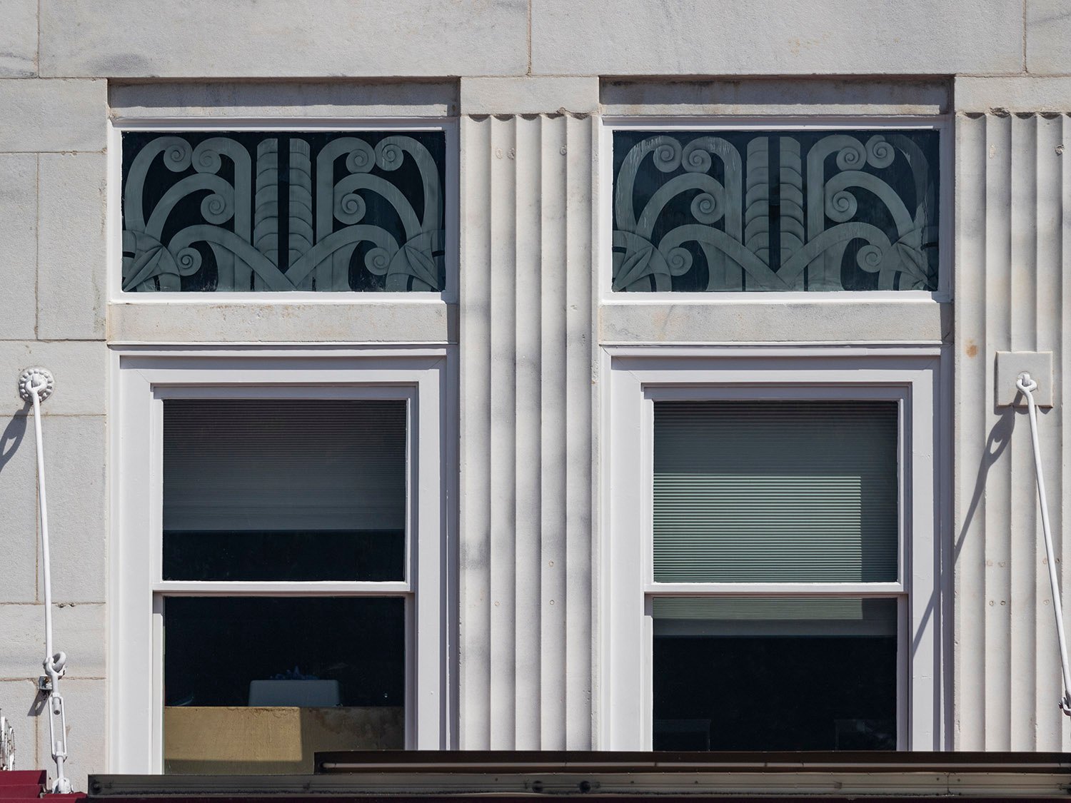 Second-floor windows and pilasters on the facade of the Strand Theatre, Marietta, Georgia