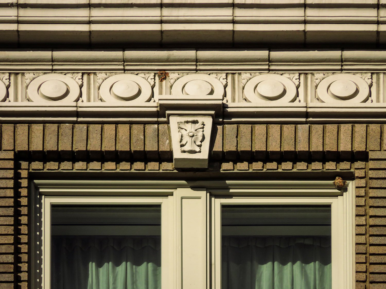 Terracotta frieze and keystone above a window on the Winecoff Hotel, Atlanta